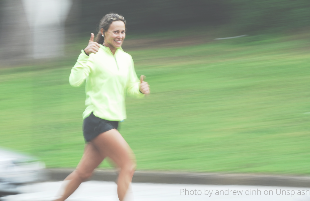 woman running and smiling